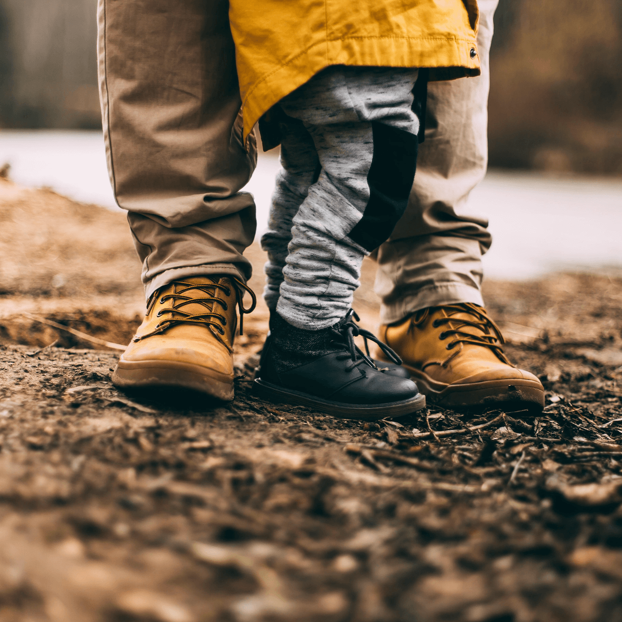 Image of feet of a father and his young son